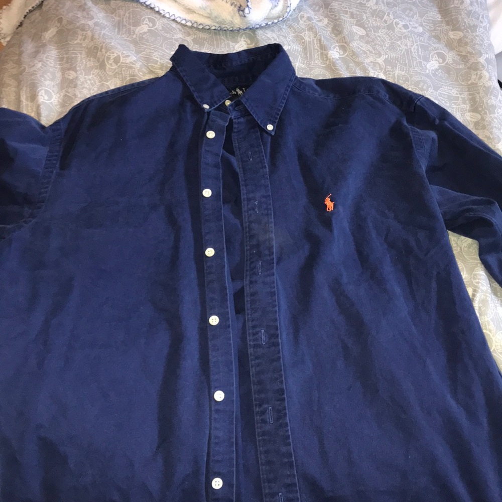 Navy button up polo with orange polo sign